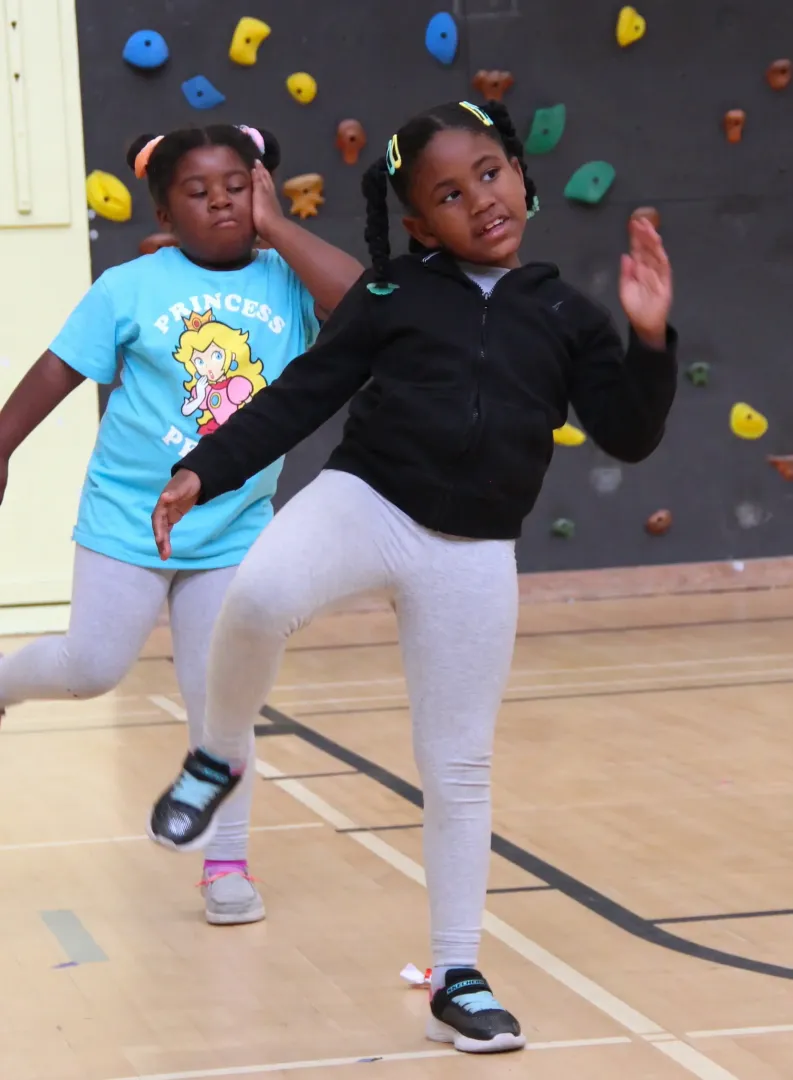 Two girls dancing