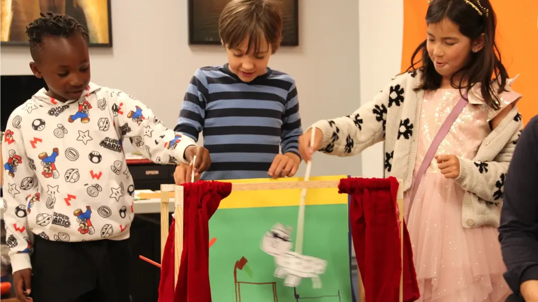 Children putting on a puppet show